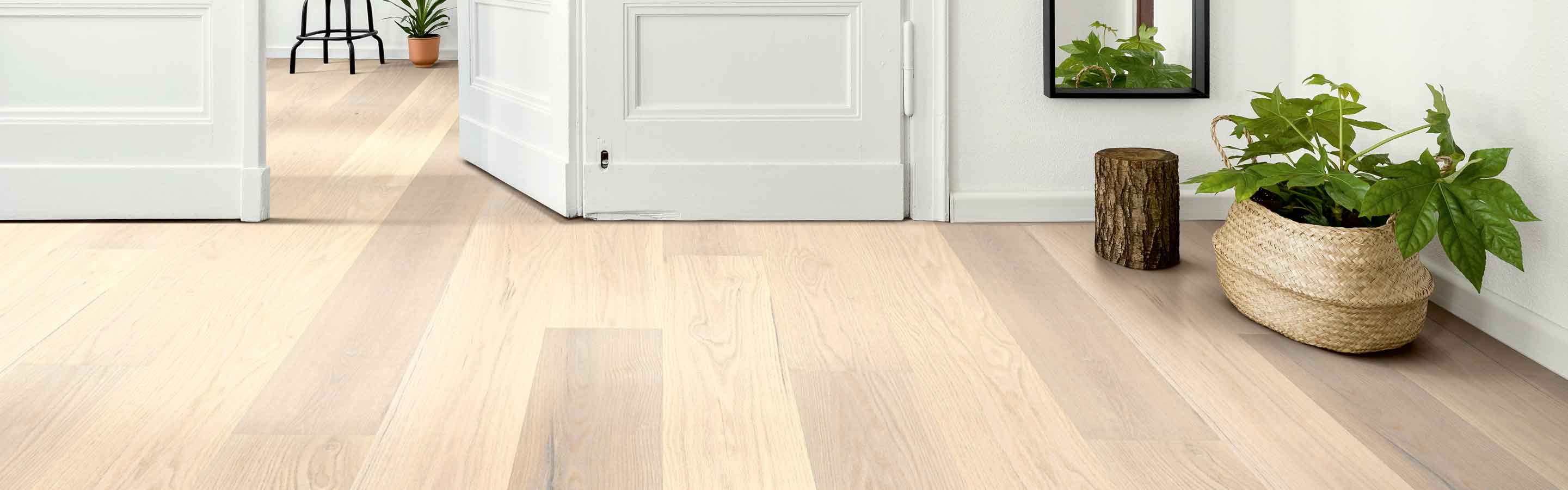white oak hardwood in contemporary entryway with greenery and full length mirror 
